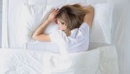 Sleeping on your stomach (Image via Getty Images)